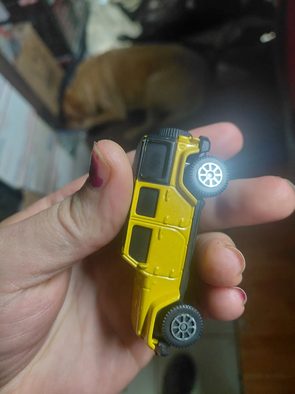 yellow 2015 Jeep Wrangler Unlimited toy car is a 1/64 scale diecast model produc